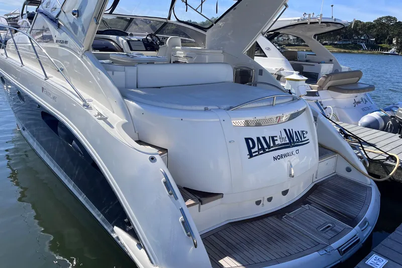 Slide: The Image of 2006 Fairline Targa 40 yacht docked, featuring sleek design and spacious deck. - 3