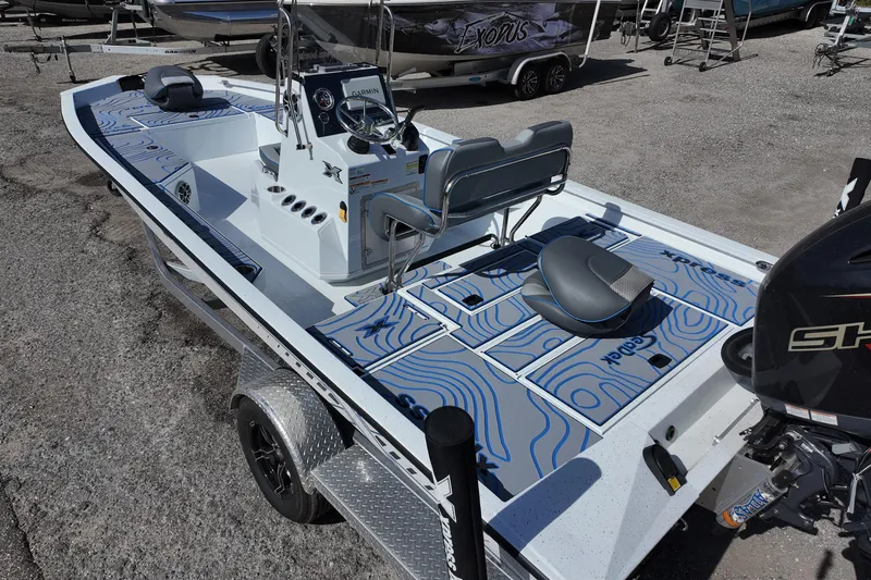 Slide: The Image of 2026 Xpress H22B Bay boat with modern design and advanced features on a trailer. - 6