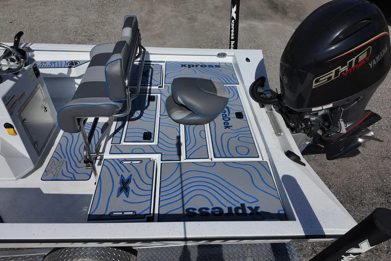 Slide: The Image of 2026 Xpress H22B Bay boat interior with Yamaha engine, featuring stylish seating and deck design. - 7
