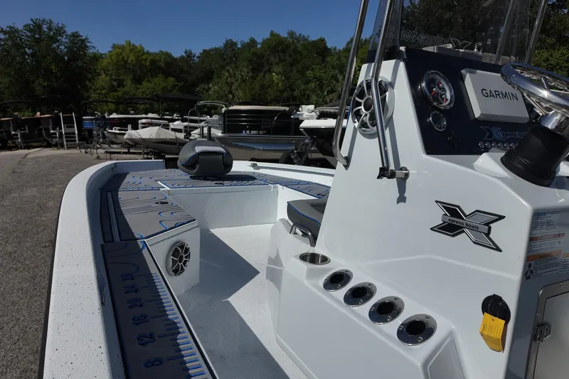 Slide: The Image of 2026 Xpress H22B Bay boat with Garmin system, sleek design, and spacious deck. - 8