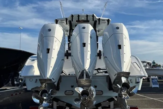Slide: The Image of 2026 Cape Horn 36 XS boat with triple outboard engines, rear view. - 13