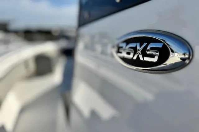 Slide: The Image of Close-up of 2026 Cape Horn 36 XS boat emblem, showcasing sleek design and branding. - 3