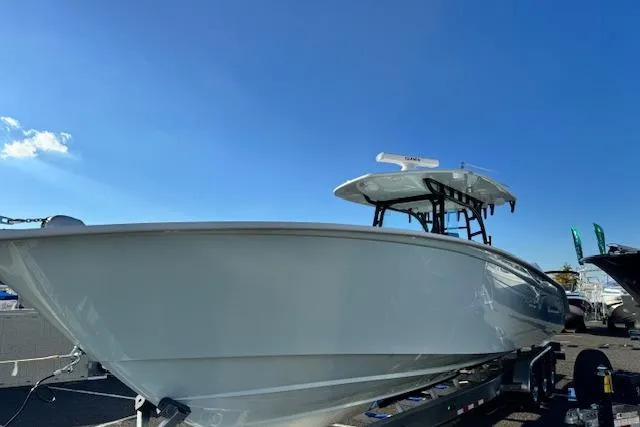 Slide: The Image of 2026 Cape Horn 36 XS boat on trailer under clear blue sky. - 7