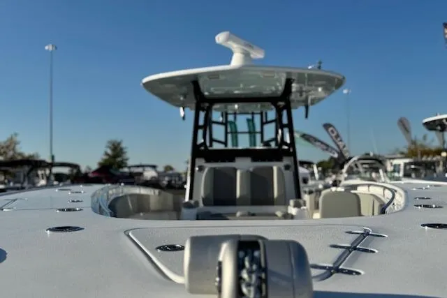 Slide: The Image of 2026 Cape Horn 36 XS boat, sleek design, showcased outdoors under clear blue sky. - 10