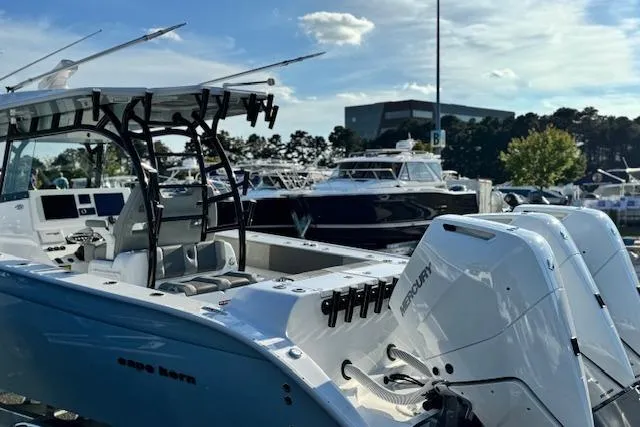 Slide: The Image of 2026 Cape Horn 36 XS boat with dual Mercury engines docked at a marina. - 14