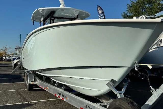 Slide: The Image of 2026 Cape Horn 36 XS boat on trailer, displayed outdoors. - 9