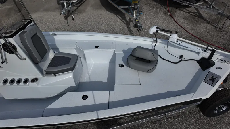 Slide: The Image of 2026 Xpress H20 boat interior with seating and fishing equipment on display. - 10