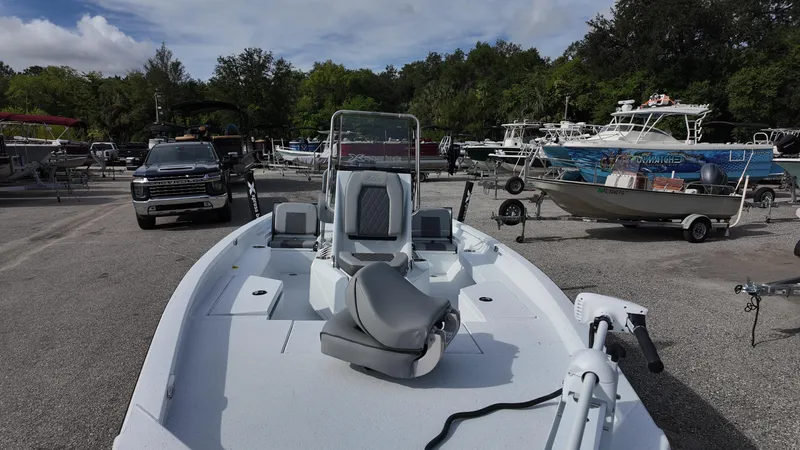 Slide: The Image of 2026 Xpress H20 boat in a marina, surrounded by various boats and a truck. - 12