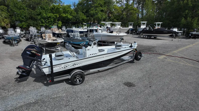 Slide: The Image of 2026 Xpress H20 boat on trailer in outdoor showroom with other boats. - 5