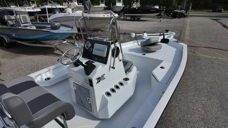 Slide: The Image of 2026 Xpress H20 boat with Garmin system, parked in a marina. - 8