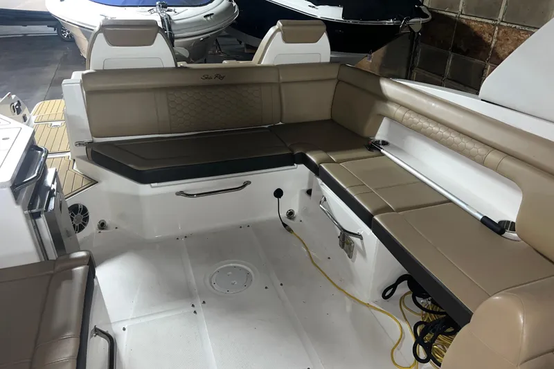 Slide: The Image of 2019 Sea Ray SDX 290 boat interior with beige seating and modern design. - 14