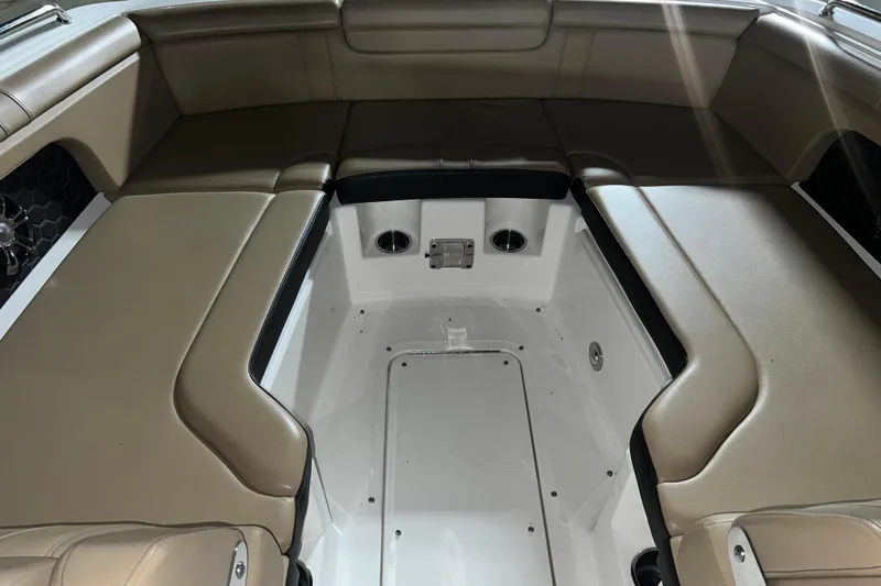 Slide: The Image of 2019 Sea Ray SDX 290 boat interior with tan seating and spacious layout. - 18