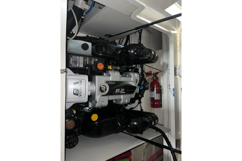 Slide: The Image of Engine compartment of 2019 Sea Ray SDX 290 boat with visible fire extinguisher. - 21