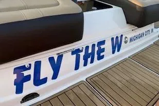 Slide: The Image of 2019 Sea Ray SDX 290 boat with "Fly the W" text on deck. - 24