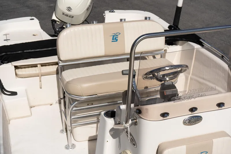 Slide: The Image of 2017 Carolina Skiff 218 DLV boat interior with steering wheel and seating. - 12