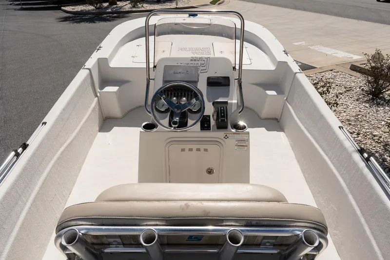 Slide: The Image of 2017 Carolina Skiff 218 DLV boat interior with steering console and seating. - 8
