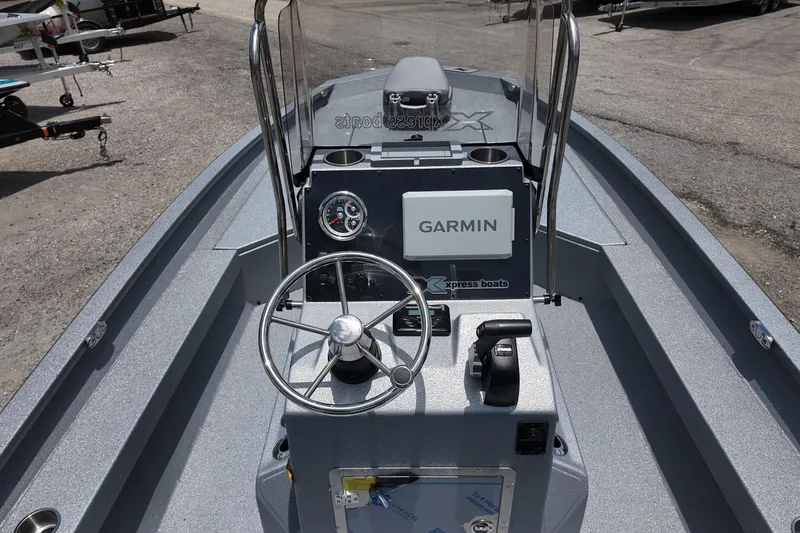 Slide: The Image of 2026 Xpress H22B Bay boat console with Garmin navigation system and steering wheel. - 16