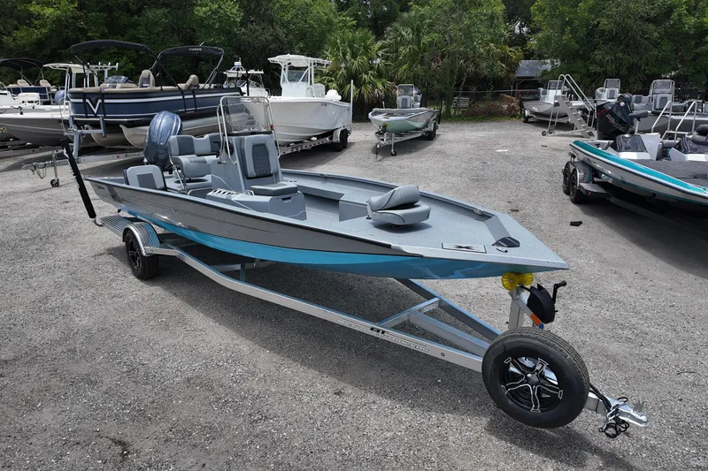 Slide: The Image of 2026 Xpress H22B Bay boat on trailer in outdoor showroom. - 3