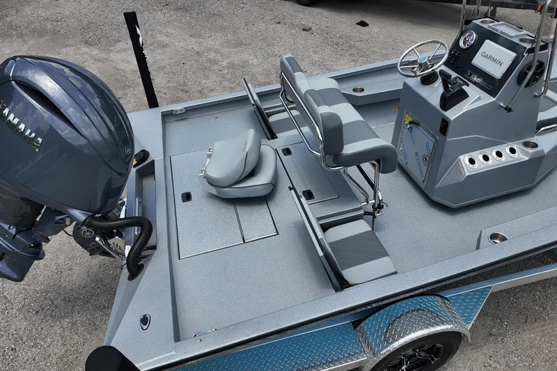 Slide: The Image of 2026 Xpress H22B Bay boat interior with Yamaha engine and Garmin navigation system. - 6