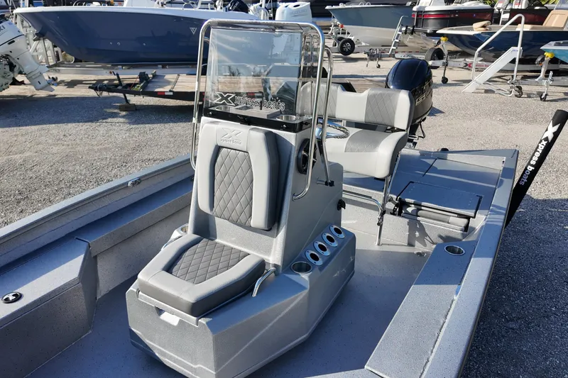 Slide: The Image of 2026 Express H20B boat with modern seating and console, displayed in a marina setting. - 12