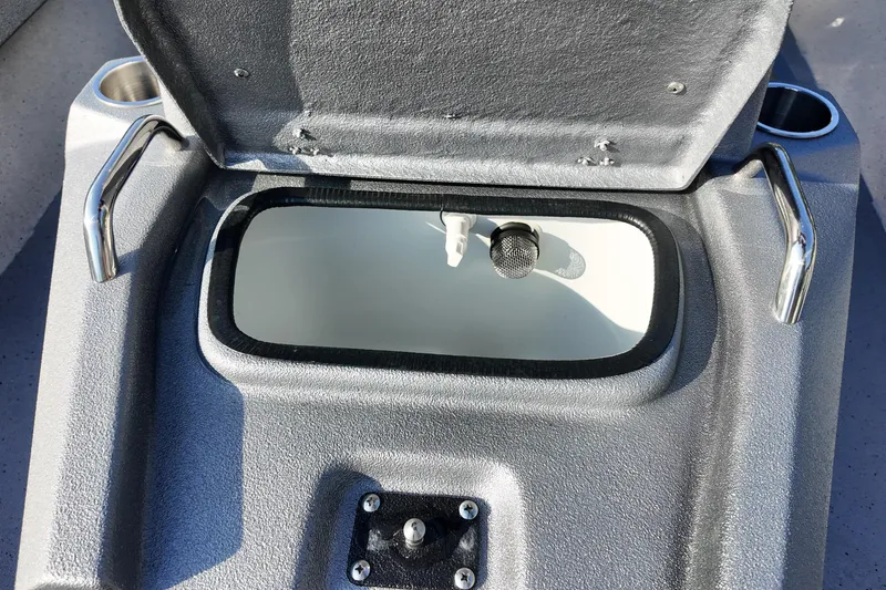 Slide: The Image of Open storage compartment on Express H20B boat, 2026 model, with metallic handles and cup holders. - 13