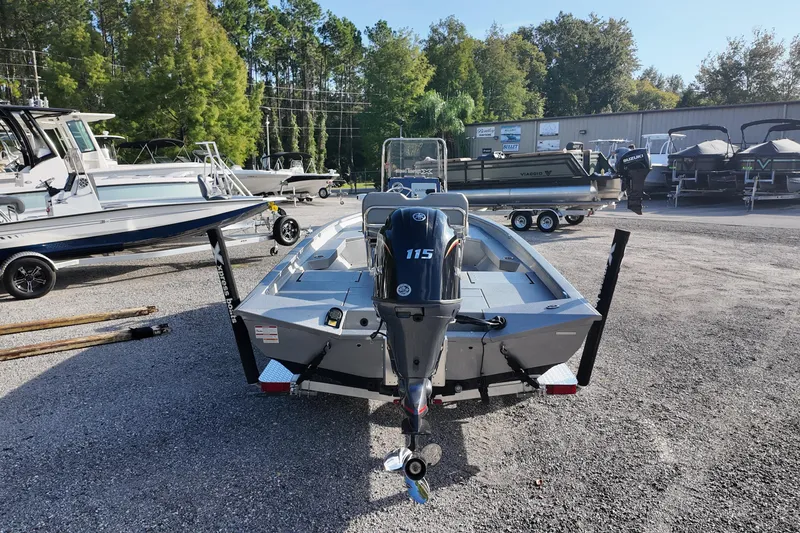 Slide: The Image of 2026 Express H20B boat with 115 HP engine in a dealership lot. - 4