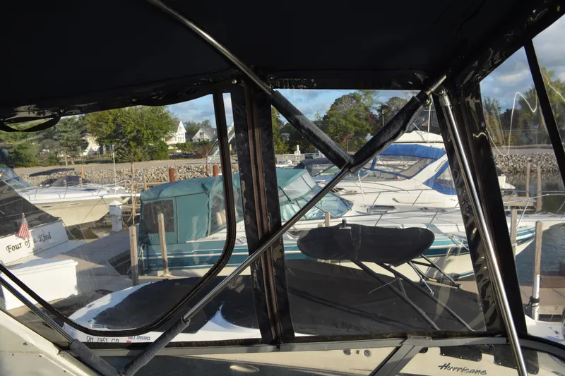 Slide: The Image of 1995 Carver 380 Santego yacht docked at marina, surrounded by other boats. - 12