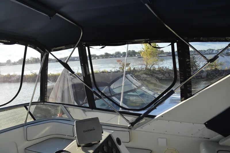 Slide: The Image of Interior view of 1995 Carver 380 Santego boat with waterway scenery. - 13