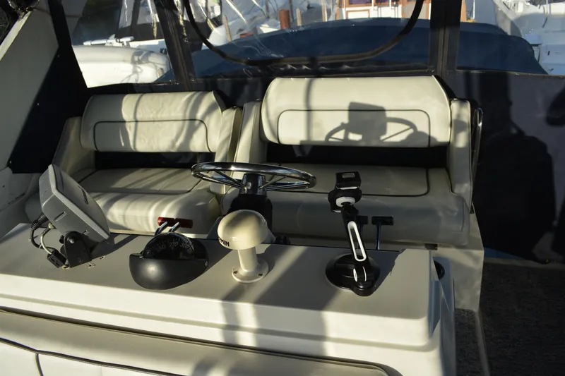Slide: The Image of 1995 Carver 380 Santego helm with steering wheel and navigation equipment. - 16