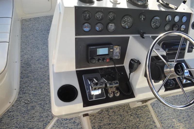 Slide: The Image of 1995 Carver 380 Santego helm with gauges, radio, and steering wheel. - 20