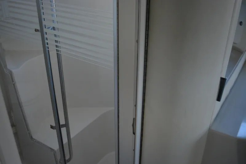 Slide: The Image of Interior view of 1995 Carver 380 Santego yacht, featuring a sleek shower area. - 31