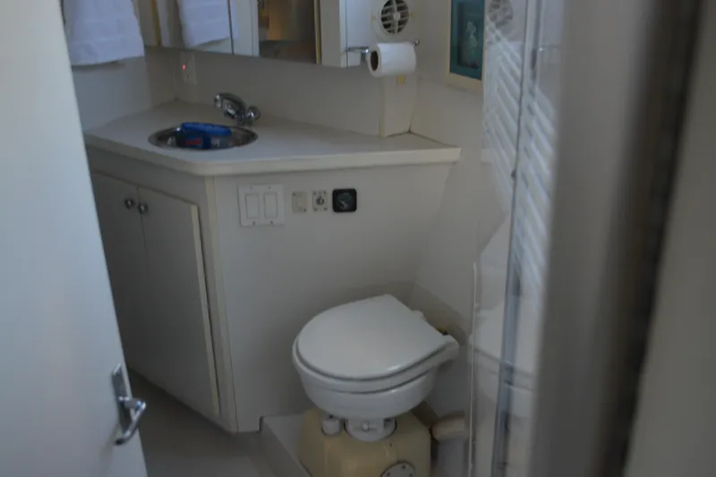 Slide: The Image of Bathroom interior of 1995 Carver 380 Santego yacht, featuring sink and toilet. - 32