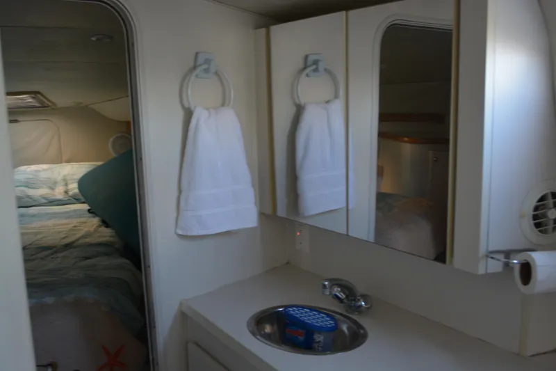 Slide: The Image of Interior of 1995 Carver 380 Santego yacht bathroom with sink and mirror. - 33