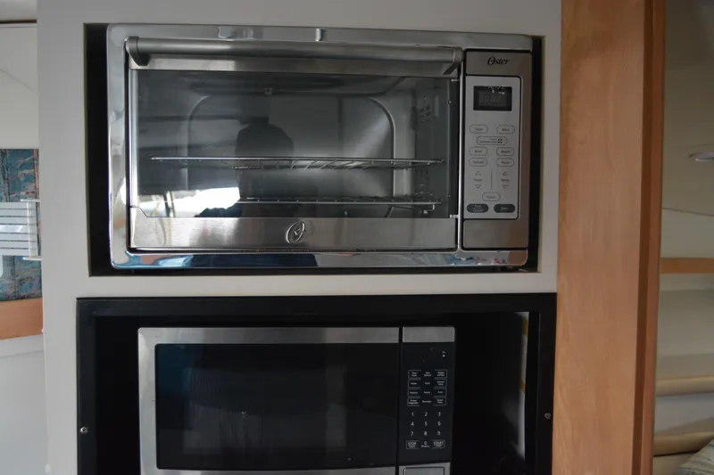 Slide: The Image of Built-in oven and microwave in 1995 Carver 380 Santego yacht kitchen. - 42