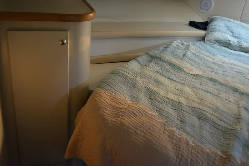 Slide: The Image of Interior cabin of 1995 Carver 380 Santego with bed and storage cabinet. - 44