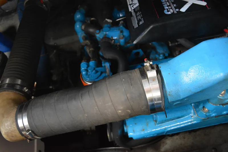 Slide: The Image of Engine components of a 1995 Carver 380 Santego, featuring blue and black parts. - 50