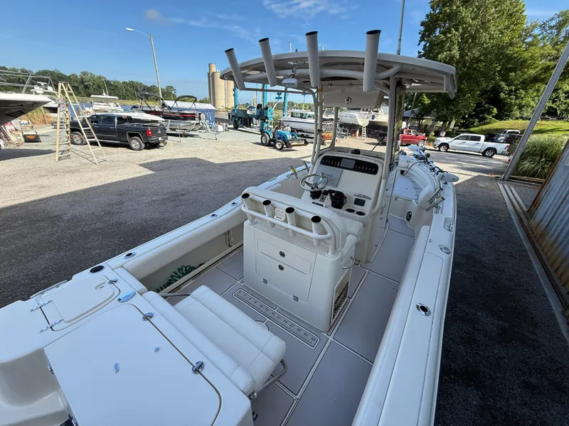 Slide: The Image of 2020 Grady-White Fisherman 257 boat in a marina, showcasing its spacious deck and helm. - 11