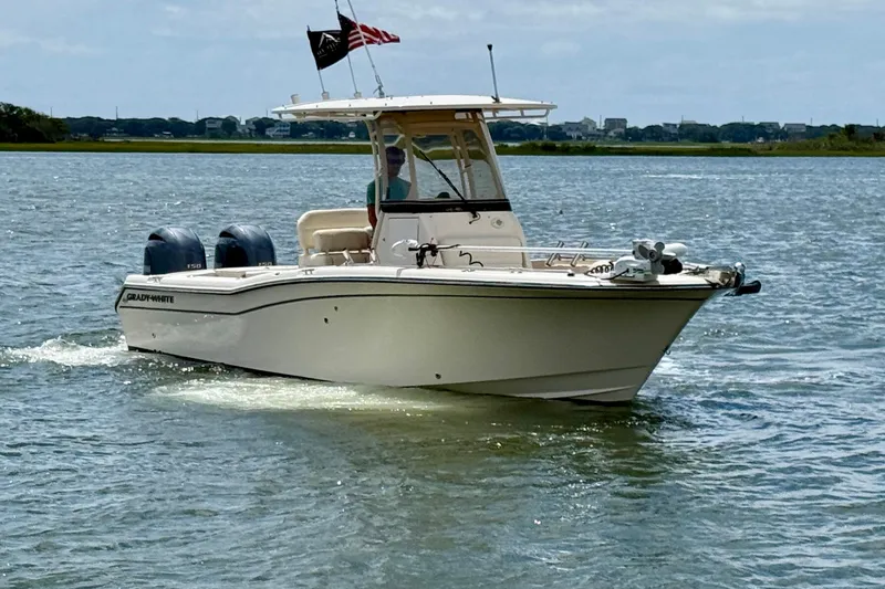 Slide: The Image of 2020 Grady-White Fisherman 257 boat cruising on a calm lake with dual engines. - 3