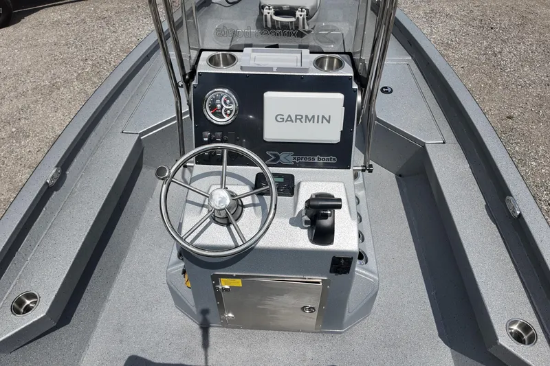 Slide: The Image of 2026 Express H20B Bay boat console with Garmin navigation system and steering wheel. - 12