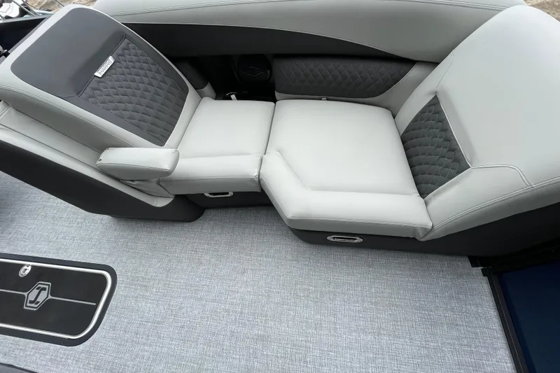 Slide: The Image of Luxurious seating on 2026 Harris Sunliner 210 boat, featuring elegant gray upholstery and quilted accents. - 12