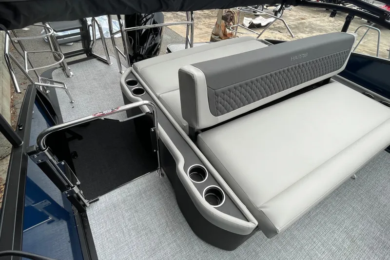 Slide: The Image of 2026 Harris Sunliner 210 boat interior with gray seating and cup holders. - 14