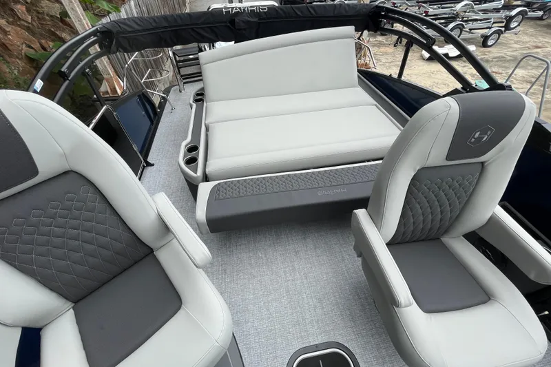 Slide: The Image of 2026 Harris Sunliner 210 boat interior with luxurious seating and modern design. - 15