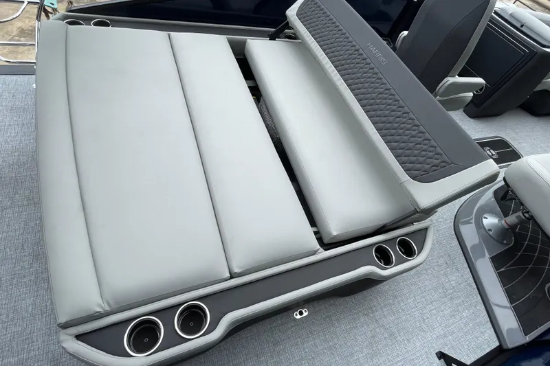 Slide: The Image of 2026 Harris Sunliner 210 boat interior with luxurious seating and cup holders. - 16