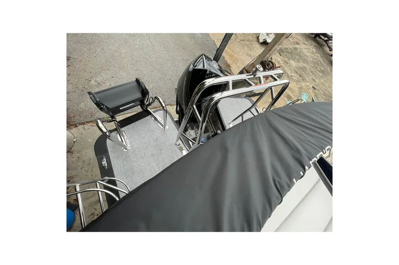 Slide: The Image of 2026 Harris Sunliner 210 boat deck with seating and railing, viewed from above. - 20