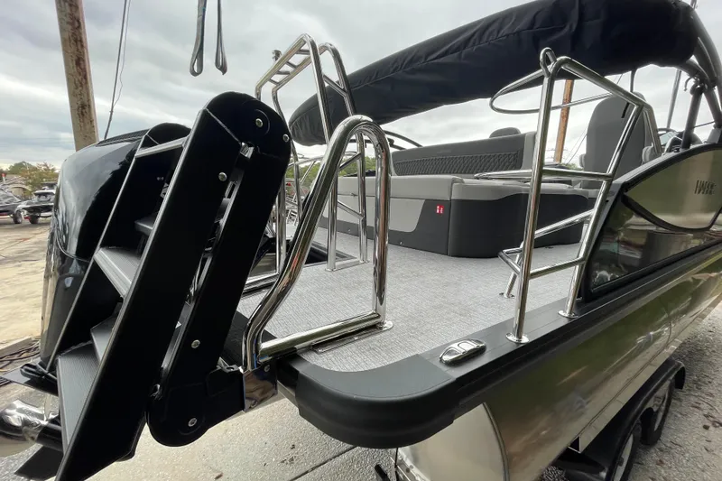 Slide: The Image of 2026 Harris Sunliner 210 boat with sleek design and modern seating. - 21