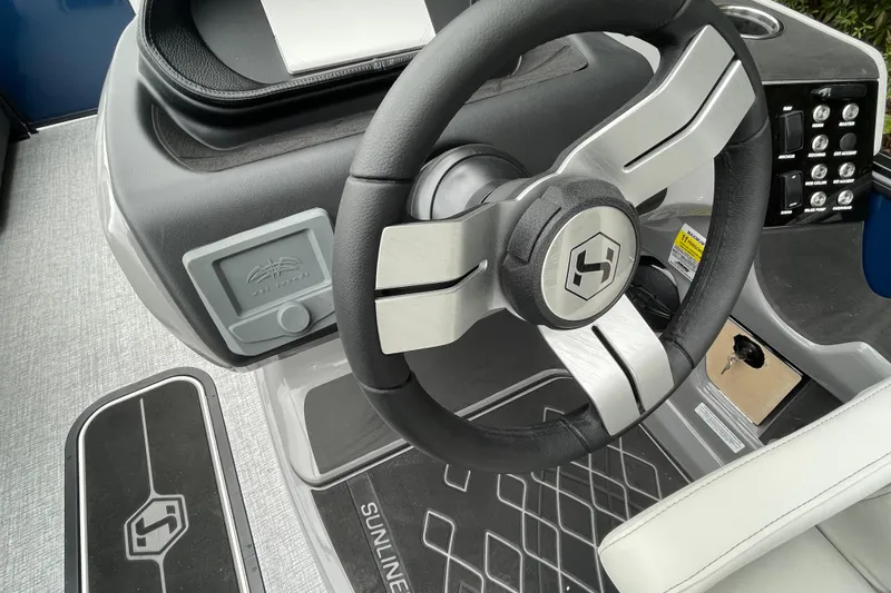 Slide: The Image of 2026 Harris Sunliner 210 steering wheel and dashboard, featuring modern controls and sleek design. - 5