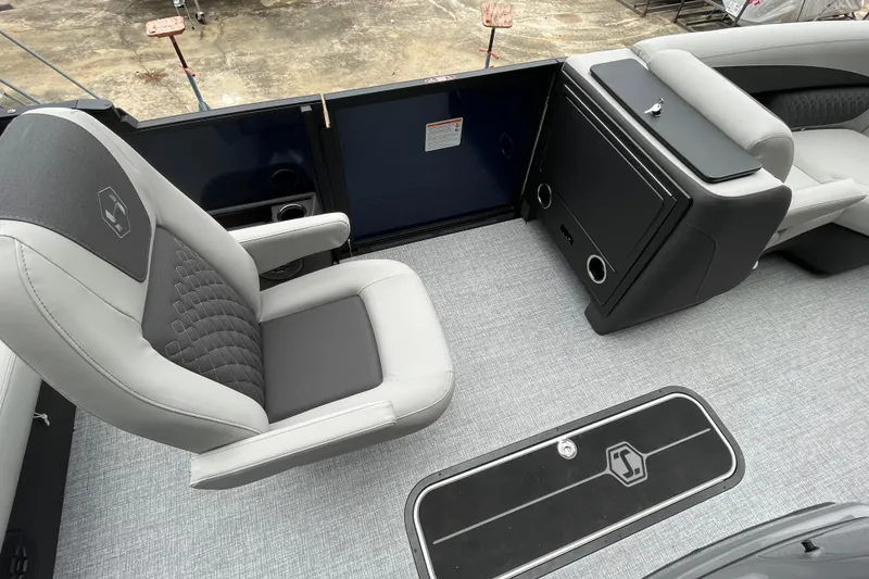Slide: The Image of 2026 Harris Sunliner 210 boat interior with gray seating and modern design. - 8