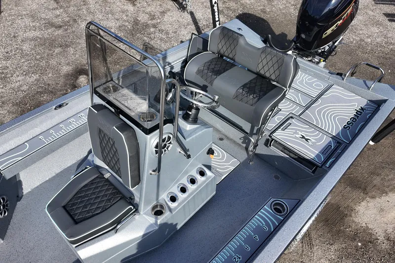 Slide: The Image of 2026 Xpress H22B Bay boat interior with modern seating and console design. - 11