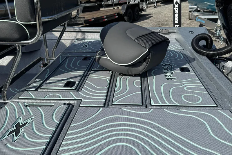 Slide: The Image of 2026 Xpress H22B Bay boat deck with stylish seating and textured flooring design. - 12