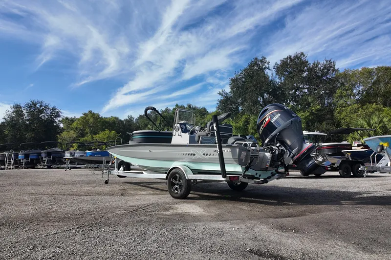 Slide: The Image of 2026 Xpress H22B Bay boat with Yamaha engine on trailer, parked outdoors. - 3